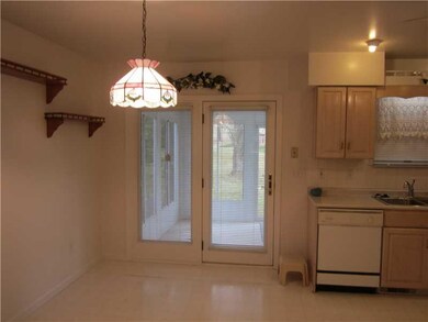 Kitchen. entrance to enclosed rear porch from the 