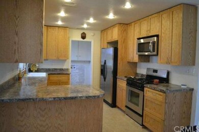 Kitchen with recess lighting view from the dining 