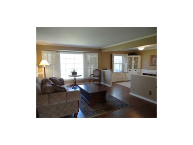 Great Room With Newly Finished Wood Floors & Plantation Shutters