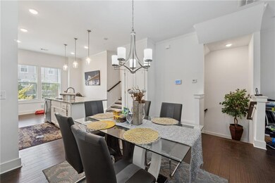 Dining space with stairway, a chandelier, dark wood-type flooring, recessed lighting, and crown molding