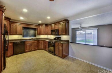 Upgraded Kitchen overlooking the backyard through 
