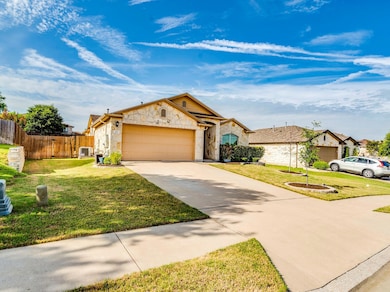 View of front of house with an attached garage, s