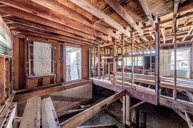 This is a gutted interior space showing exposed wo