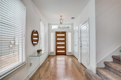 Foyer with stairway, light wood-style flooring, a