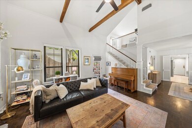 Living area with high vaulted ceiling, ceiling fa