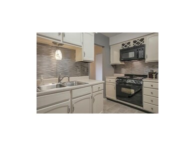 Trendy metal backsplash.