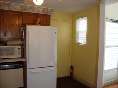 New refrigerator, door to garage, foyer to right