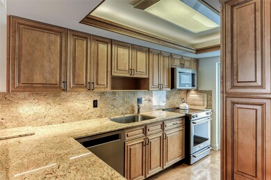 Wood cabinets and stainless steel appliances offer