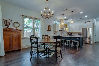 Dining space with baseboards, visible vents, dark 