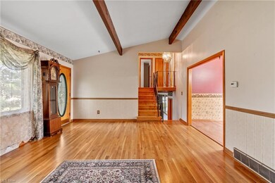 Spare room featuring light hardwood flooring and l