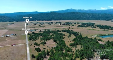 Overview of rural landscape featuring a water and mountain view