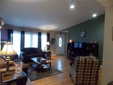 Living Room featuring gleaming oak hardwood floor.
