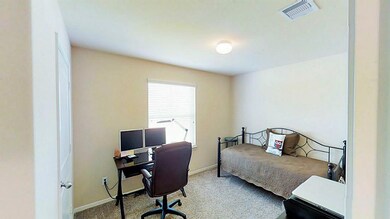 Bright front bedroom perfect for an office or a traditional bedroom