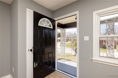 Foyer entrance with light wood-type flooring and p