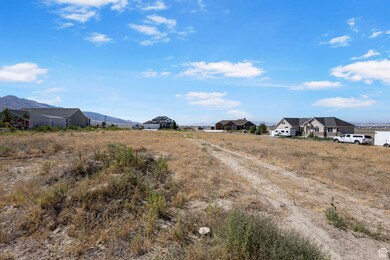 View of dirt / gravel road featuring a mountain view
