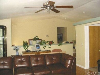 More living room and ceiling fan