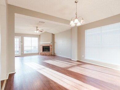 Unfurnished living room with visible vents, dark w