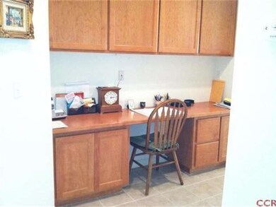 Built-in desk and cabinets in hallway.