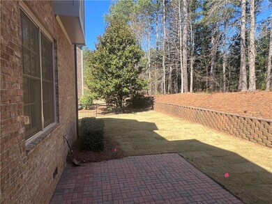 View of yard with a patio and fence