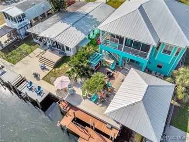 Back deck, fire pit, boat dock and boad house with