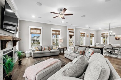 Living room with a fireplace, hardwood / wood-styl