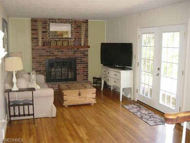 The comfortable family room is warmed by a toasty 