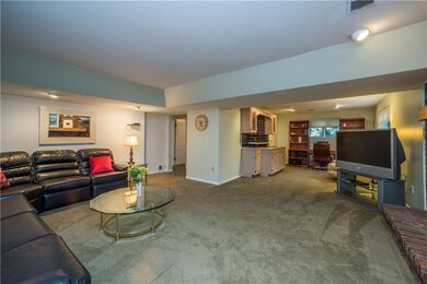 The large family room extends to a wet bar area, p