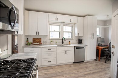 Kitchen featuring light hardwood / wood-style floors, a wealth of natural light, and sink