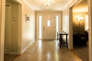 Entrance of the home divides the living room and k