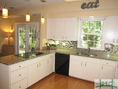 Ample granite counter space and an abundance of wh