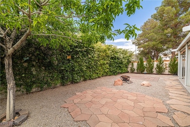View of patio featuring a fire pit and a fenced ba