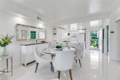 Dining area, kitchen, and view of condo entry.