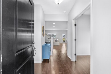 Corridor featuring dark hardwood / wood-style floo