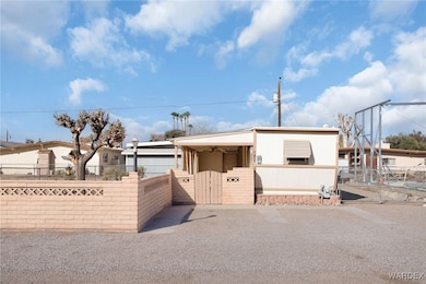 Manufactured / mobile home with a gate and a fenced front yard