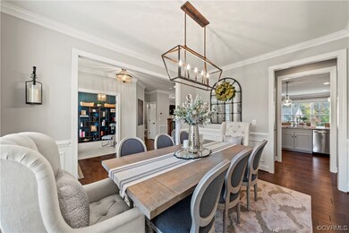 Dining Room with wainscoting and formal moulding