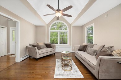 Entry into living room with vaulted ceilings