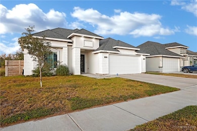 Prairie-style house with a front yard and a garage