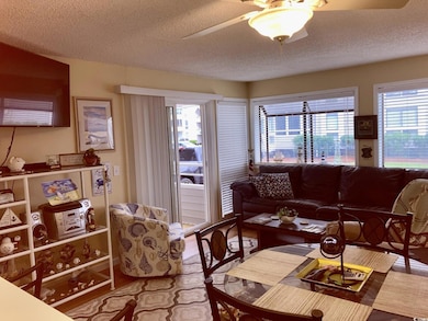 Living room featuring a textured ceiling and ceili