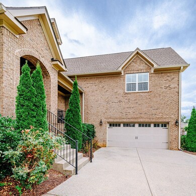 Front of home with attached garage.