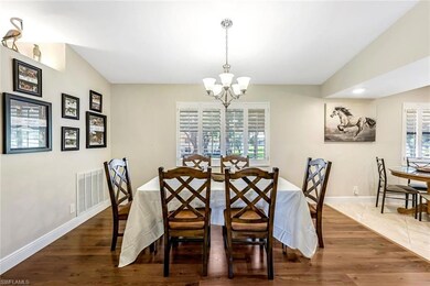 Dining room with a chandelier, a wealth of natural