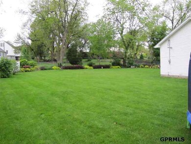 The entire lot is over half an acre and has in-ground sprinkler and beautiful landscaping.