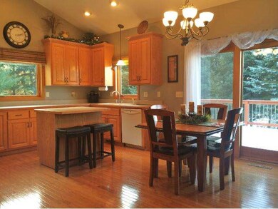 Kitchen is filled with beautiful oak custom cabine