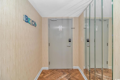 Entryway with light parquet flooring