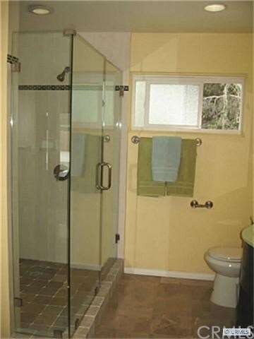 Master Bathroom, frameless shower door. Marble flo