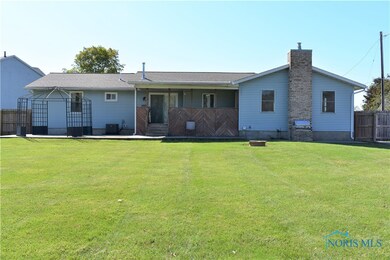What a backyard to entertain! Covered deck down to
