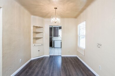 Quaint dining room with custom built in shelving a