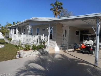 View of front of property featuring a carport, a p