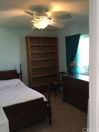 Bedroom #2 with Ceiling Fan and Large Front Window