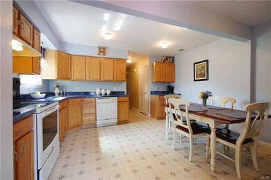 The eat-in kitchen has been expanded and features 