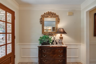 Interior space with ornamental molding and light t